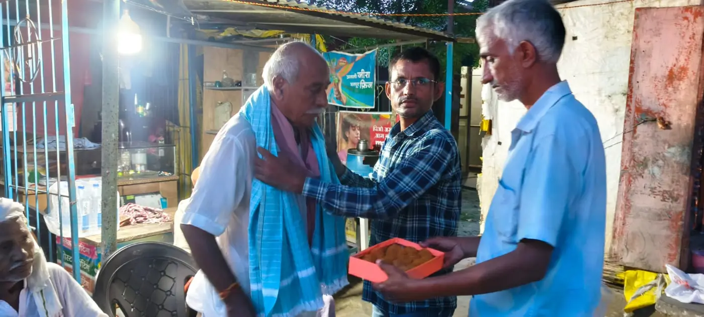 NGO volunteer supporting a senior citizen